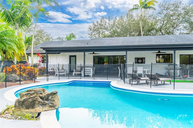 view of pool with ceiling fan, an outdoor hangout area, and a patio area