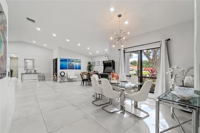 dining space with vaulted ceiling and an inviting chandelier