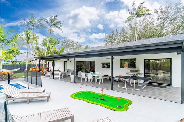 view of patio featuring a fenced in pool, an outdoor living space, and ceiling fan