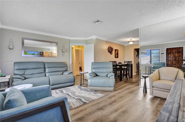 living room with hardwood / wood-style flooring and a textured ceiling