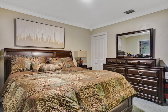 bedroom with crown molding, light carpet, and a closet