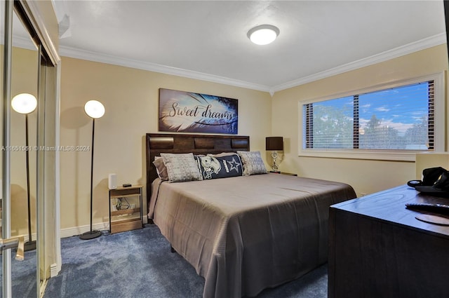 carpeted bedroom featuring a closet and ornamental molding