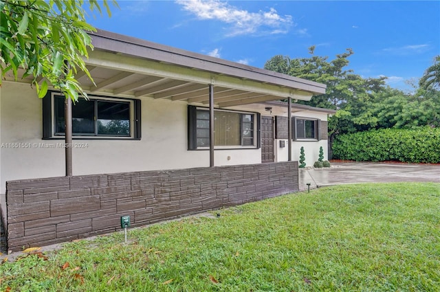 exterior space with a front yard