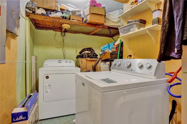 clothes washing area featuring washing machine and dryer