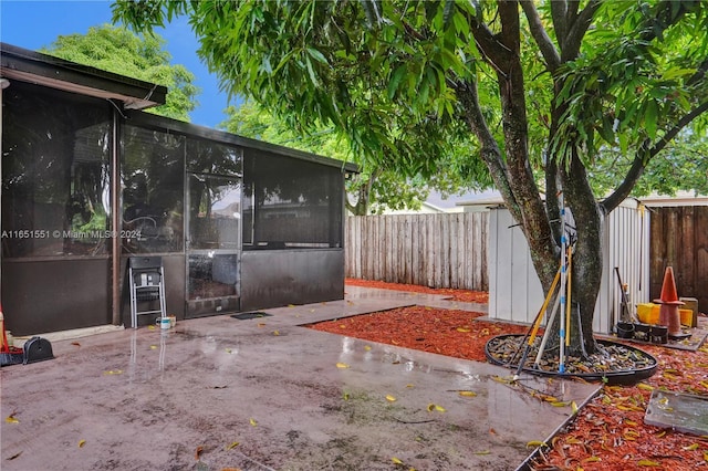 770 NW 175th Dr, Miami Gardens, FL 33169 - view of patio / terrace featuring a fenced backyard and a sunroom