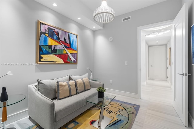 living area featuring recessed lighting, baseboards, and visible vents