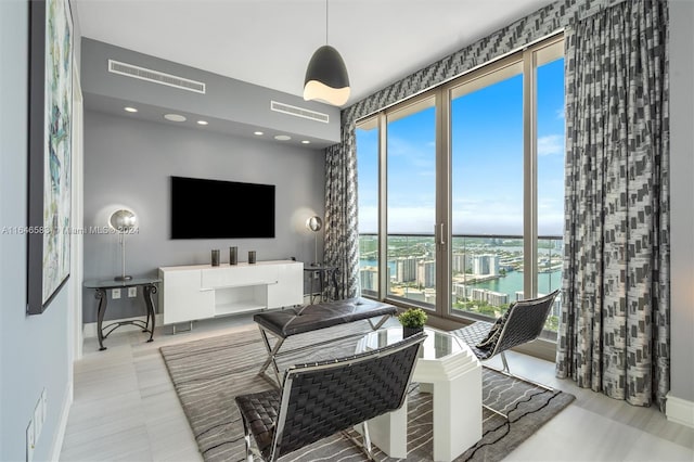 living area featuring visible vents and baseboards