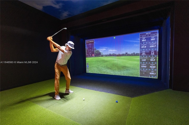 game room with golf simulator