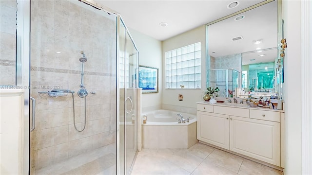 bathroom with vanity, independent shower and bath, and tile patterned floors