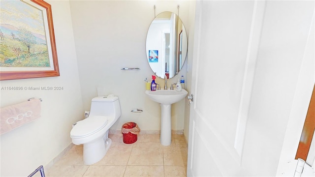 bathroom with tile patterned flooring and toilet