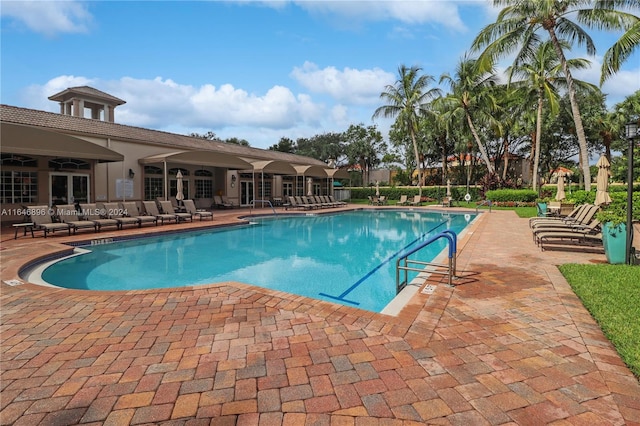 view of pool featuring a patio area and ceiling fan