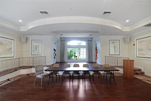 dining room featuring ornamental molding and dark hardwood / wood-style floors