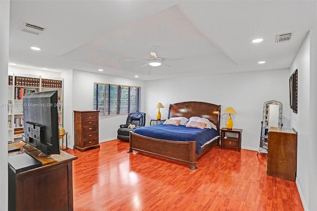 tiled living room with ceiling fan