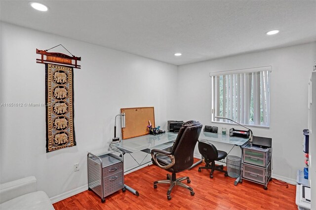 home office with light wood-type flooring