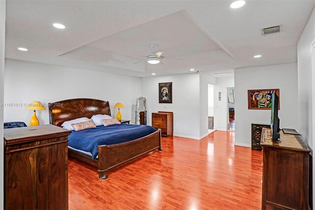 bedroom featuring ceiling fan and hardwood / wood-style flooring