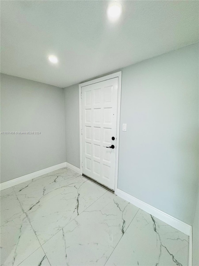 foyer featuring a textured ceiling