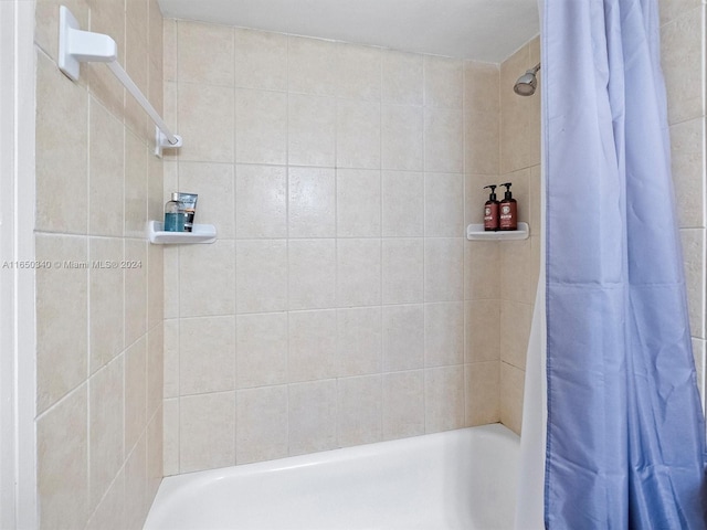 bathroom featuring shower / bath combination with curtain