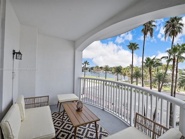 balcony featuring a water view