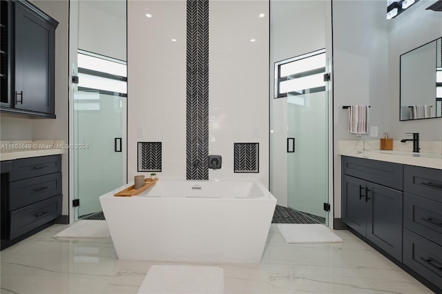 bathroom featuring separate shower and tub and vanity