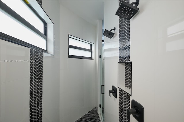 bathroom with a tile shower