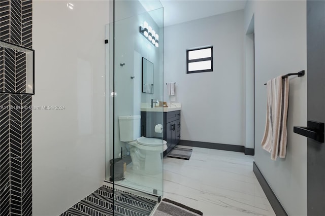 bathroom featuring vanity, toilet, and walk in shower