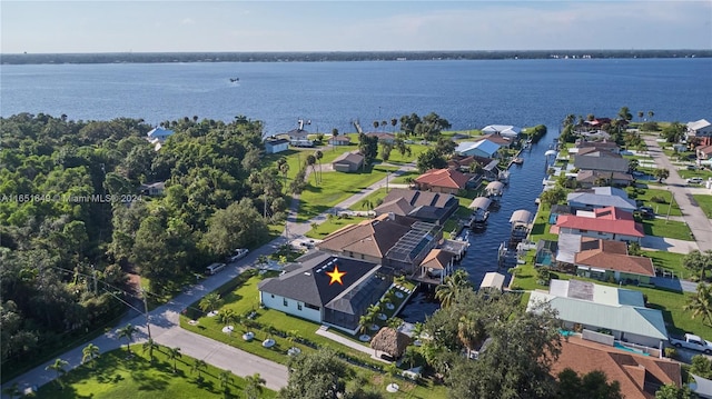 birds eye view of property with a water view