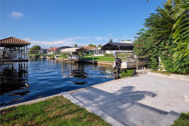 dock area featuring glass enclosure and a water view