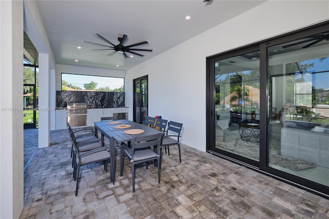 view of patio / terrace featuring area for grilling, ceiling fan, and grilling area