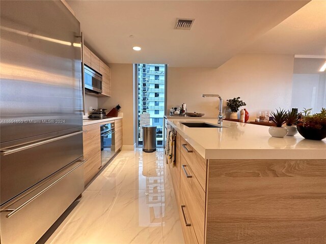 kitchen featuring stainless steel appliances and sink