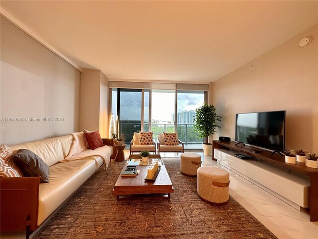 living room with floor to ceiling windows