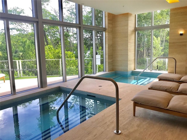 view of pool with an indoor in ground hot tub