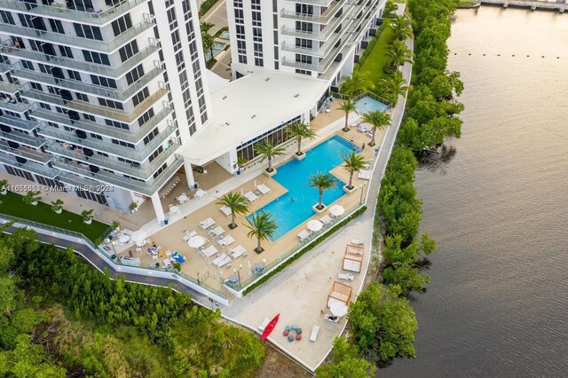 birds eye view of property with a water view