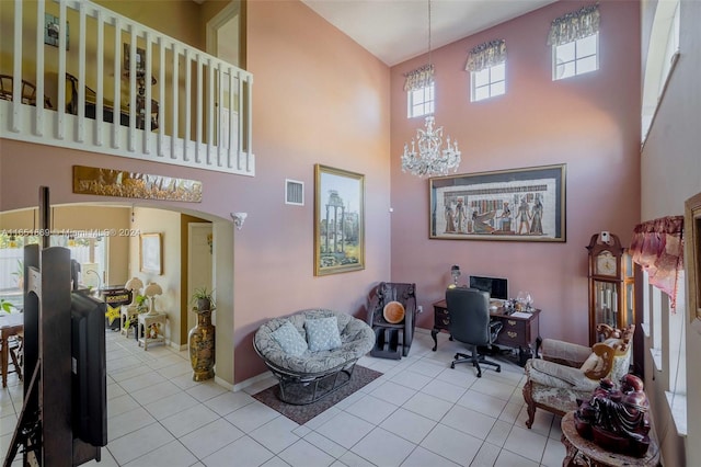 interior space featuring a high ceiling and a notable chandelier