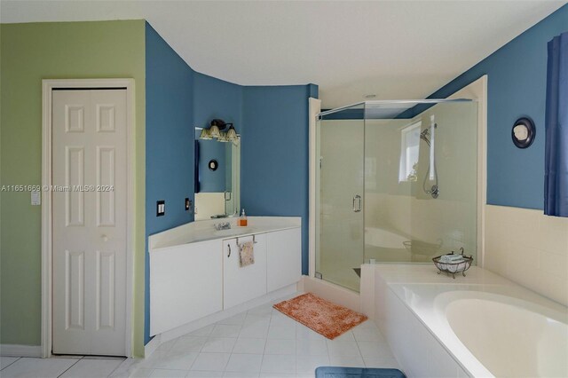 bathroom featuring vanity, tile patterned floors, and shower with separate bathtub