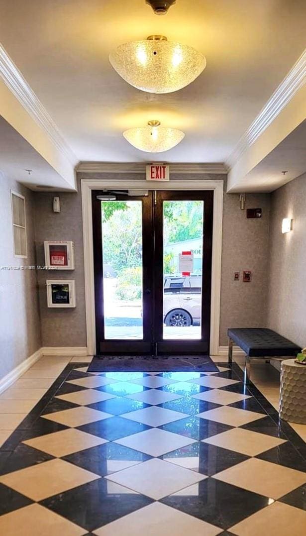 doorway with french doors and ornamental molding