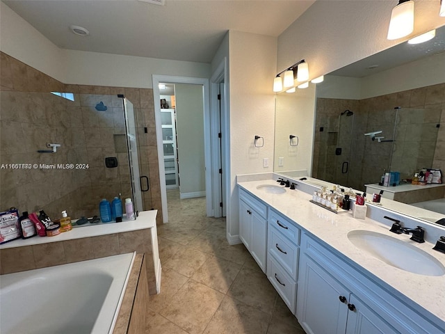 bathroom with vanity, independent shower and bath, and tile patterned flooring