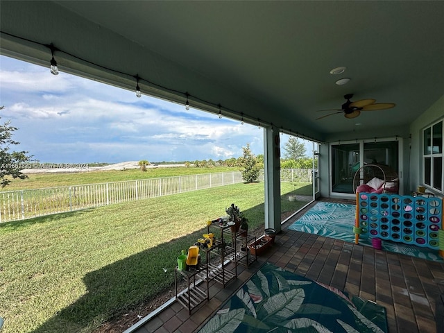 sunroom / solarium with ceiling fan