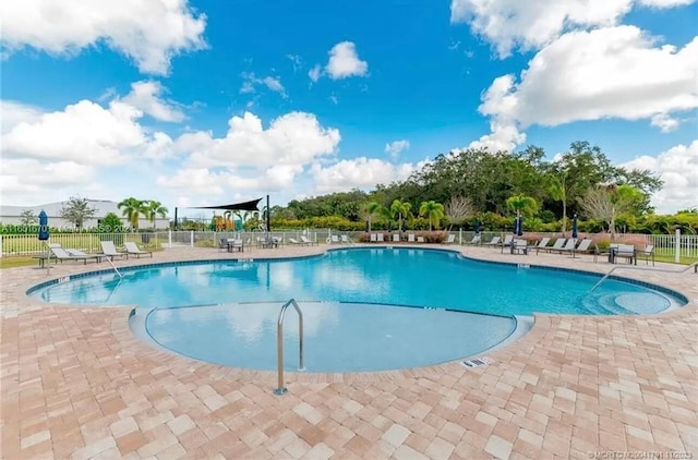 view of swimming pool with a patio