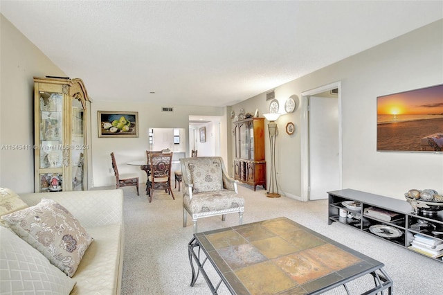 living room featuring light carpet