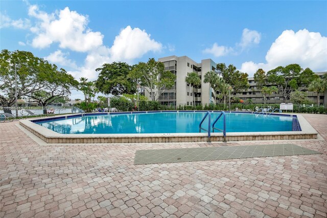 view of swimming pool with a patio area