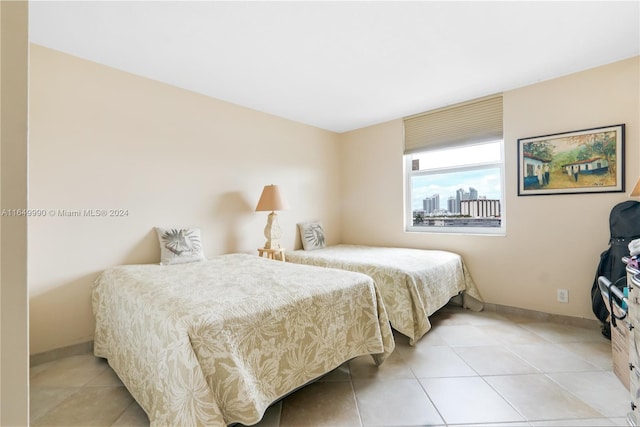 bedroom featuring light tile patterned floors