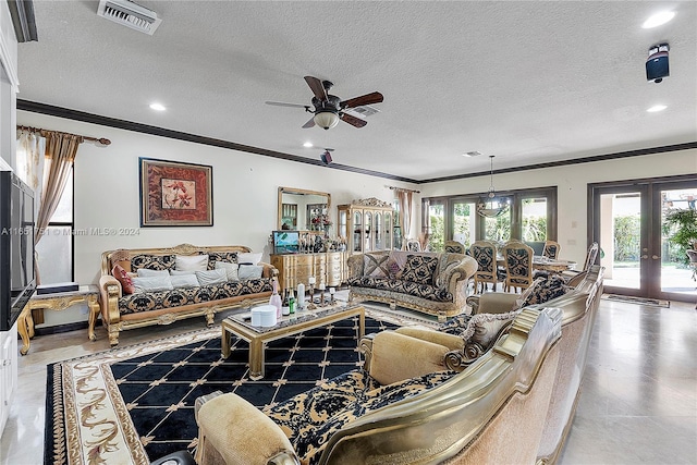 living room with a textured ceiling, ceiling fan, french doors, and a wealth of natural light