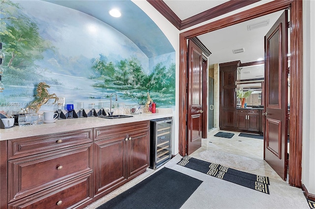 bar featuring beverage cooler, crown molding, and sink