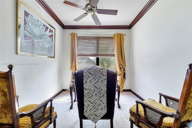 carpeted home office with a textured ceiling, ceiling fan, and crown molding