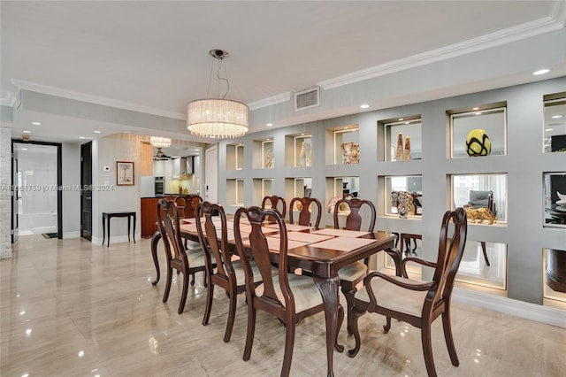 dining area with a chandelier and ornamental molding