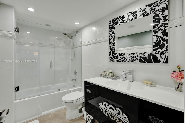 1880 S Ocean Dr Unit Ts106, Hallandale Beach, FL 33009 - full bathroom with shower / bath combination with glass door, vanity, tile walls, recessed lighting, and toilet