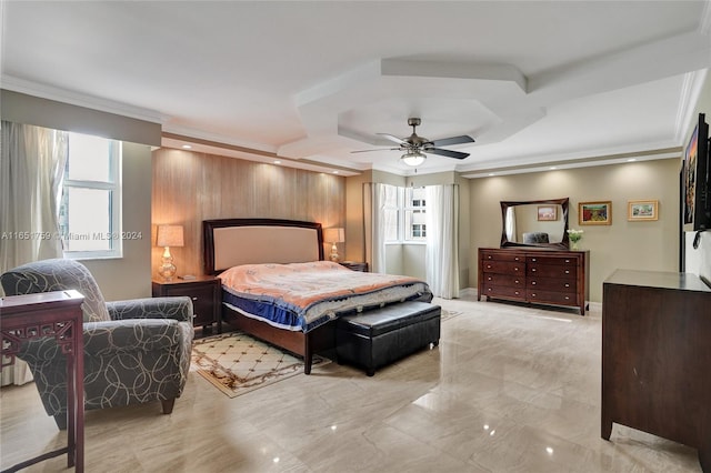 bedroom with multiple windows, ceiling fan, crown molding, and wood walls