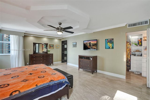 bedroom featuring a raised ceiling, ceiling fan, and ornamental molding