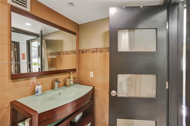 1880 S Ocean Dr Unit Ts106, Hallandale Beach, FL 33009 - bathroom with tile walls, visible vents, recessed lighting, and vanity