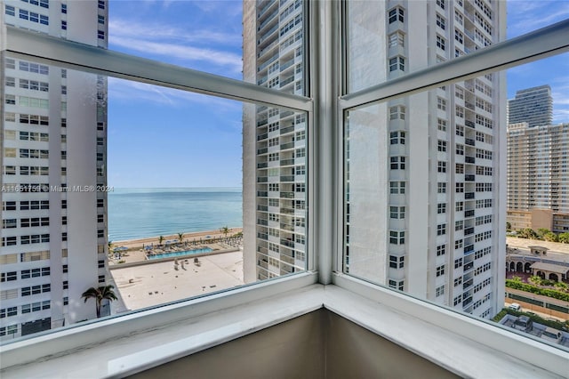 balcony featuring a water view